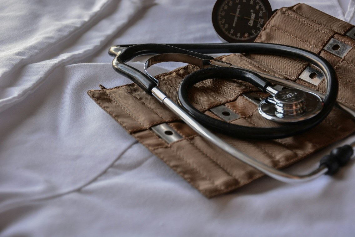 A stethoscope in a brown leather bag